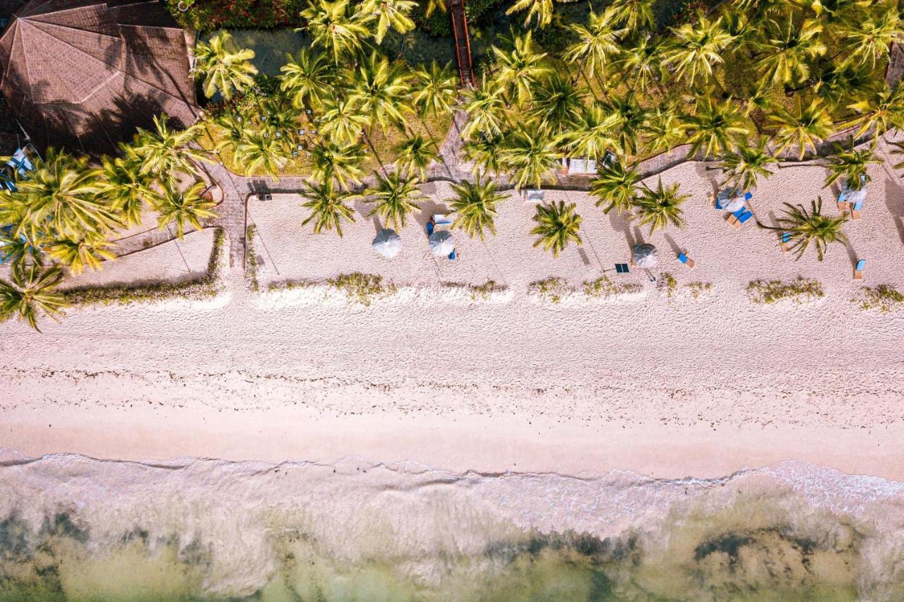 Diani Reef Beach Resort & Spa - Your Beachfront Bliss Awaits Diani Beach Exteriér fotografie Beach at the resort